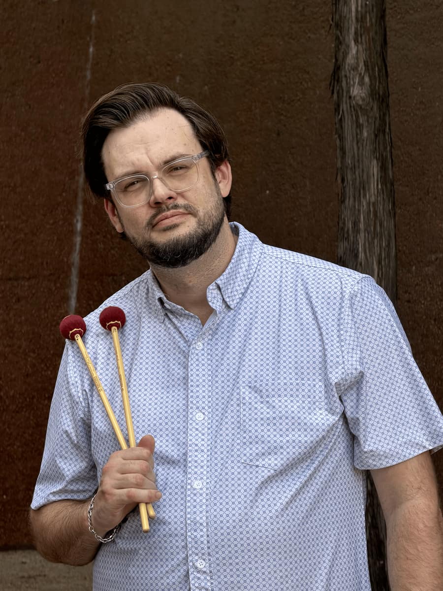 Taylor Dwyer holding a pair of keyboard percussion mallets
